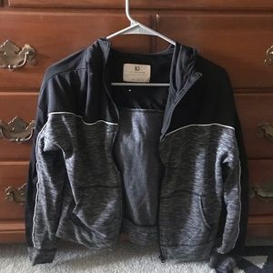 Grey and black zip up sweatshirt.